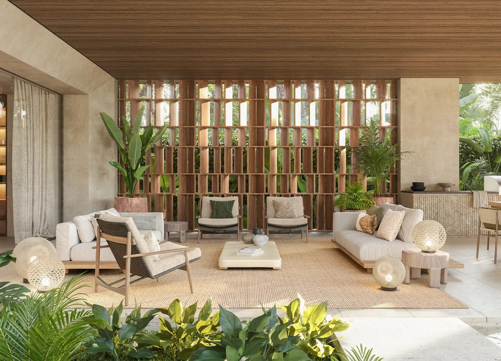 Salón amueblado abierto al jardín tropical por inecohaus